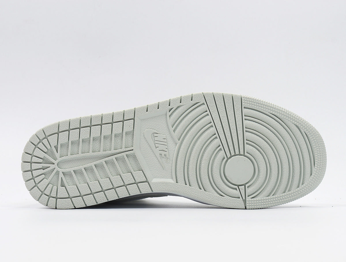 Bottom view showing the rubber outsole with circular and segmented traction patterns.