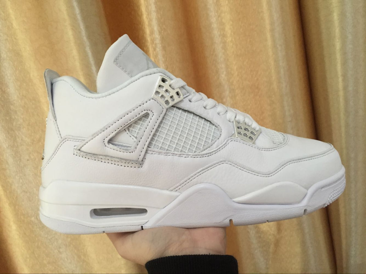 Side view of the white sneaker highlighting the high-top shape, mesh side panel, lace wings, and sculpted sole.