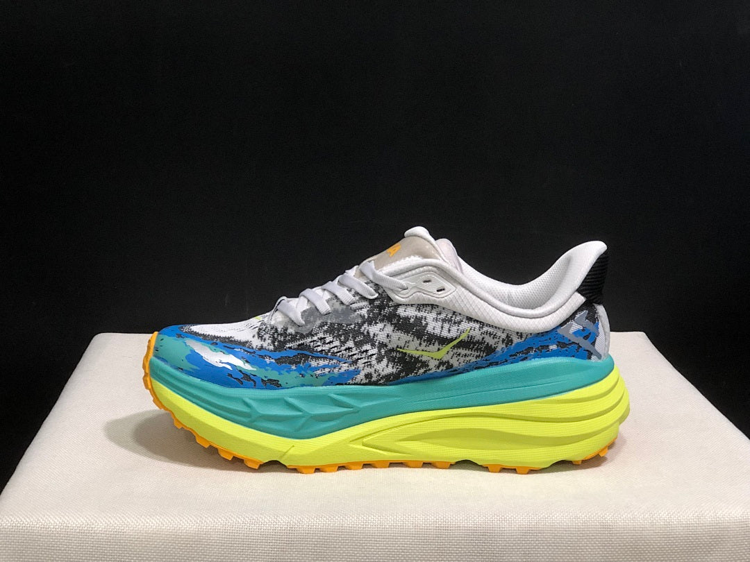 HOKA Stinson 7 Trail Sneakers in Blue and Lime