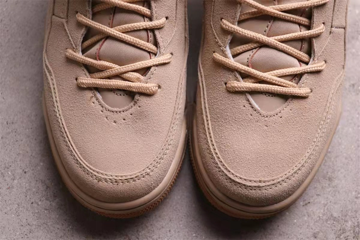 Close-up of the perforated toe boxes, laces, and stitched panel details.
