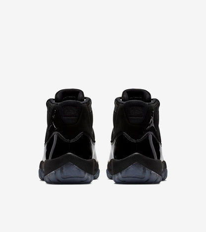 Studio rear view of a pair of black high-top sneakers.