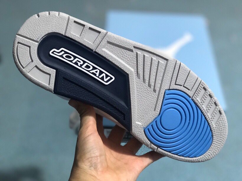 Outsole of a Jordan 3 Retro sneaker with blue traction detail