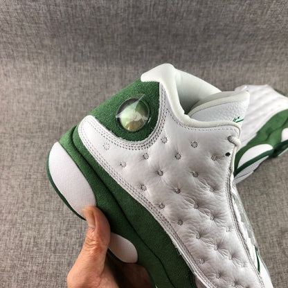 Close-up of the white textured side panel, green heel section, and translucent circular detail.