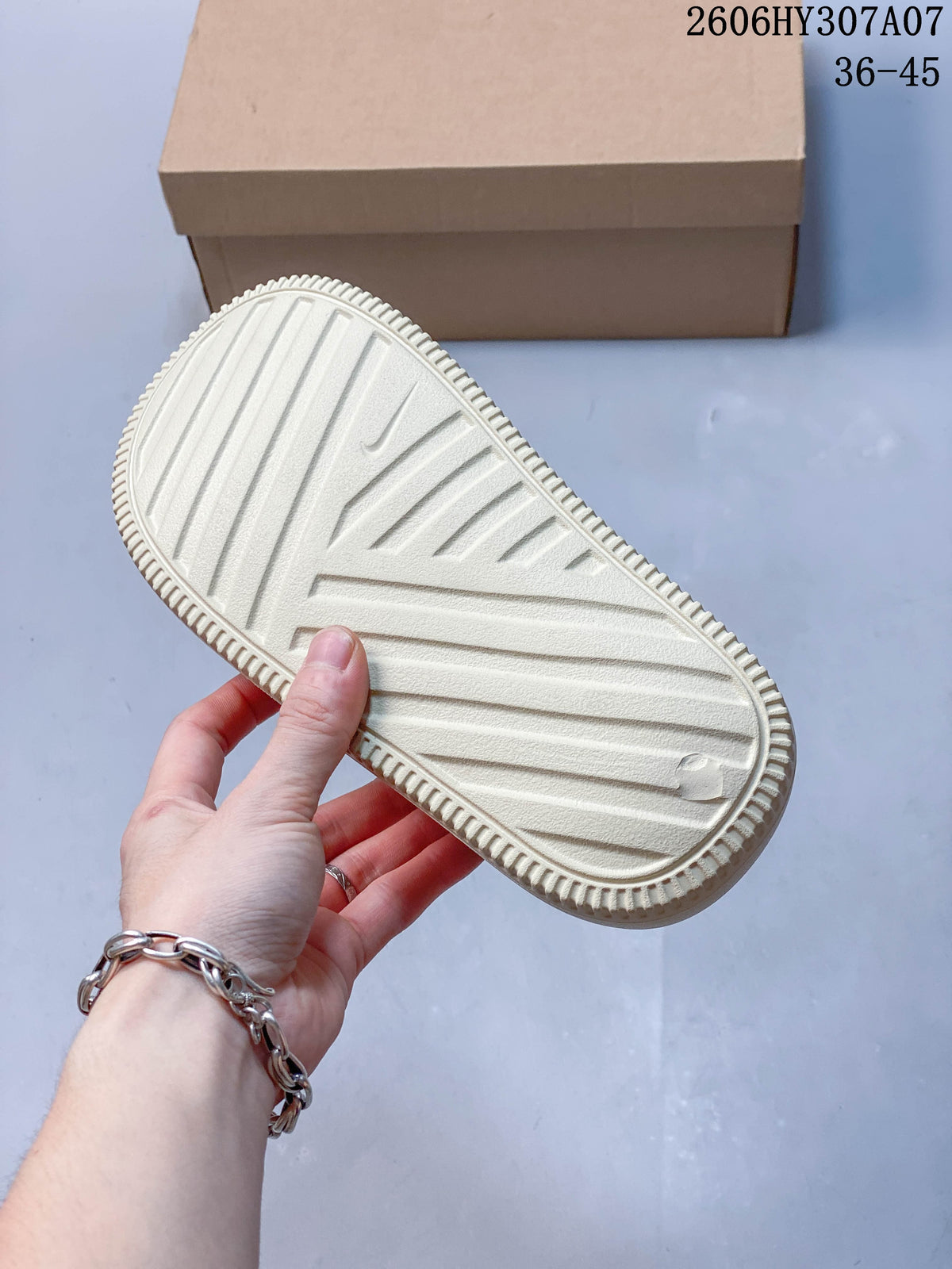 Nike Calm Slide Thong Sandals in Cream
