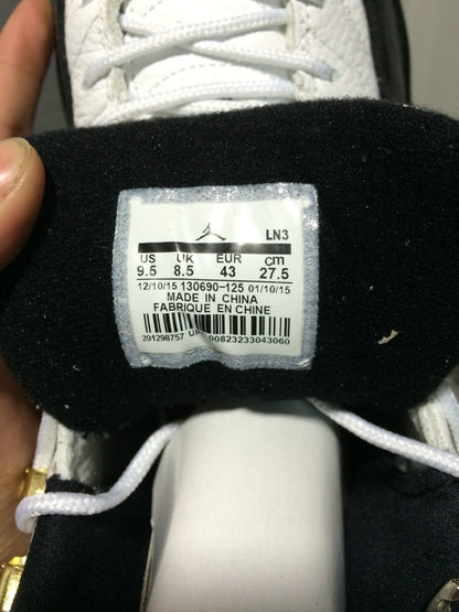 Interior tongue label showing US 9.5, UK 8.5, EUR 43, CM 27.5, and style code 130690-125.