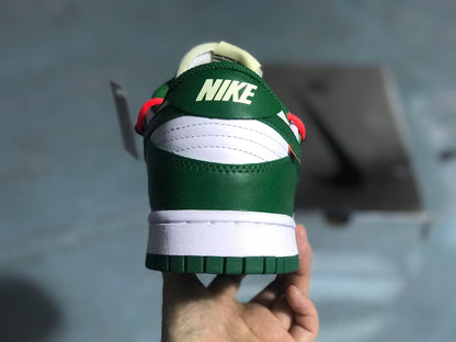 Rear view showing the green heel panel, white heel detail, white midsole, and green outsole.