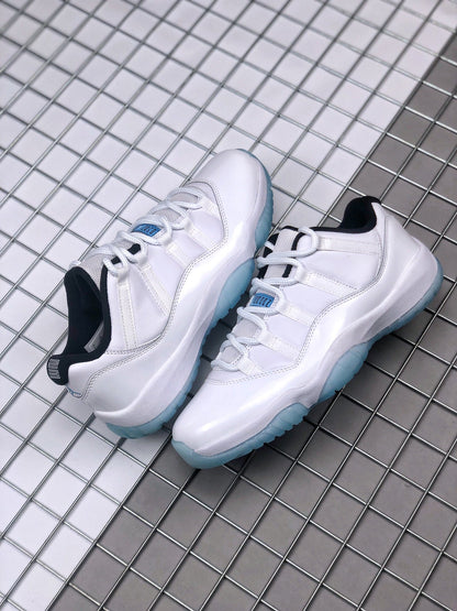 Pair of white Jordan Air Jordan 11 Low sneakers displayed on a metal grid surface.