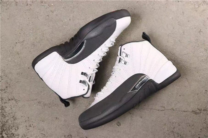 Pair of white and dark grey high-top sneakers viewed from above.