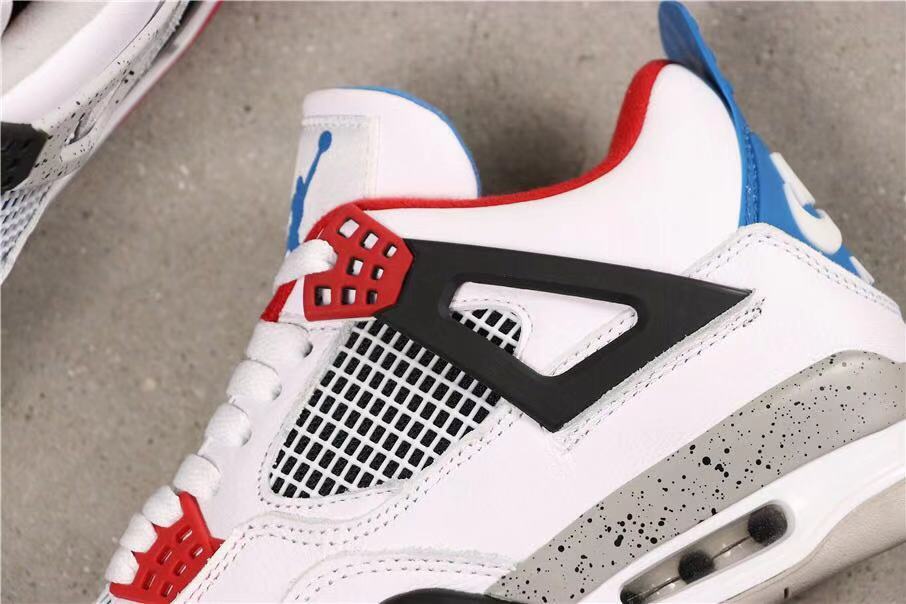 Close-up of the lateral side showing black and red lace supports, mesh panels, and a speckled midsole.