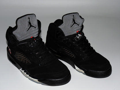 Pair of black Air Jordan 5 high-top sneakers viewed from the front, with gray tongues and red details