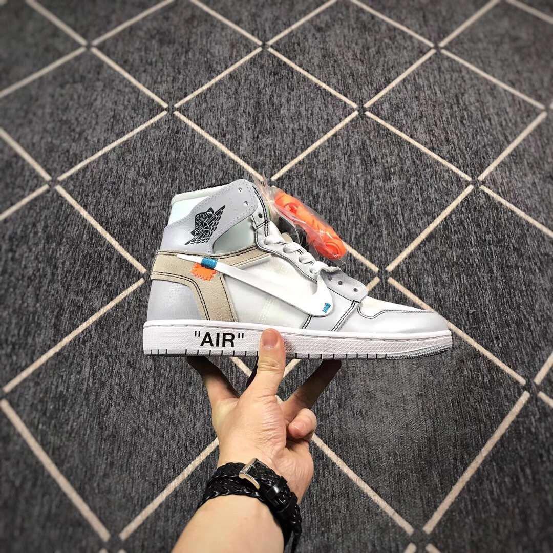 Side profile of one high-top sneaker showing the winged collar logo, grey heel panel and quoted AIR midsole text.
