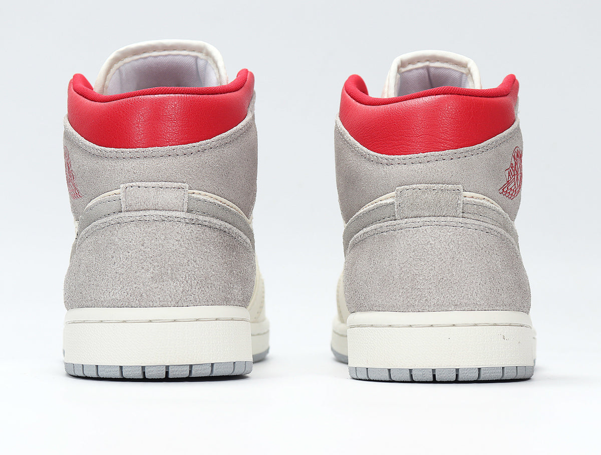 Rear view of the pair showing grey heel panels, red padded collars and grey outsoles.