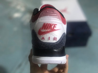 Rear view of the white, black, and red Jordan 3 Retro SE sneaker