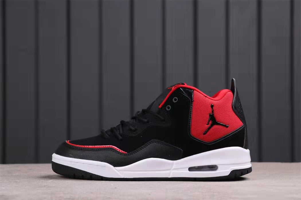 Side profile of the sneaker showing the black upper, red collar panel, and white midsole.