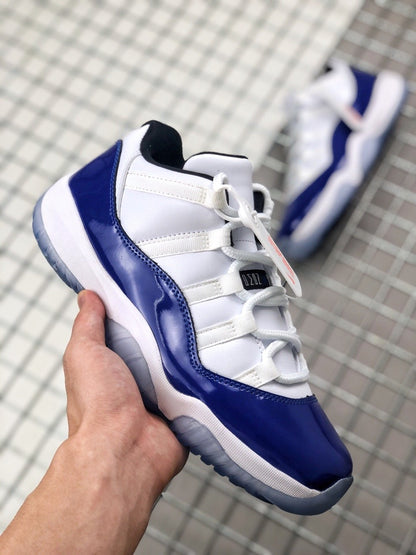 Angled top-side view showing the lacing system, tongue, blue toe overlay, and heel.