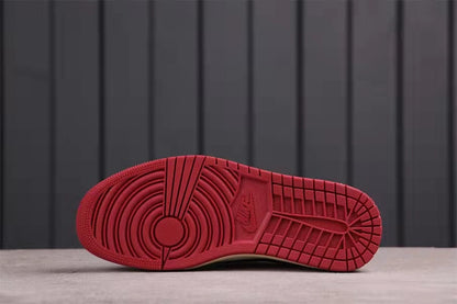 Underside view showing the red rubber outsole and patterned traction layout.