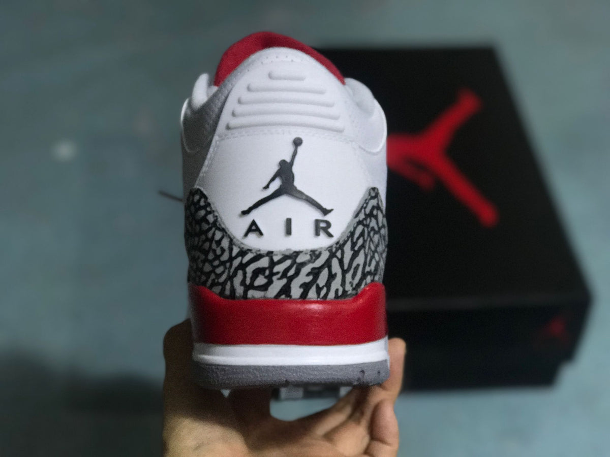 Rear view showing elephant print, red heel accent, and Jumpman Air branding