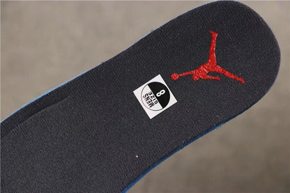 View of the dark insole with a red Jumpman logo and size sticker marked 8.