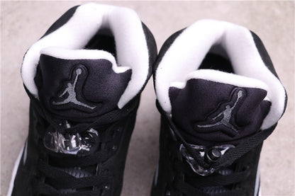 Top view showing the padded white collar, black tongue, Jordan branding, and clear lace toggles.