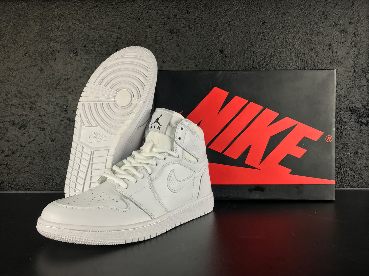 White high-top sneakers displayed with a Nike shoebox, showing the perforated toe, Swoosh branding and textured outsole.
