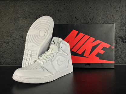 White high-top sneakers displayed with a Nike shoebox, showing the perforated toe, Swoosh branding and textured outsole.