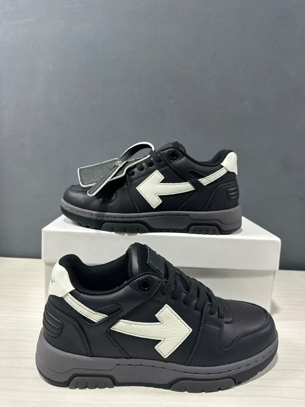Three-quarter view of the sneakers highlighting the lace-up construction and layered sole.