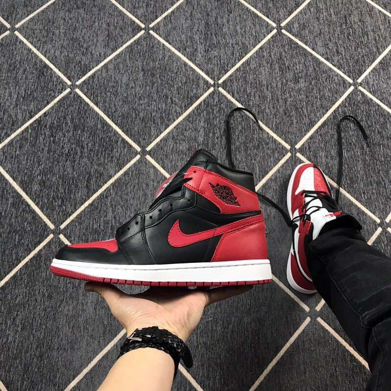 Side profile of a black and red high-top sneaker with a white midsole and red outsole.
