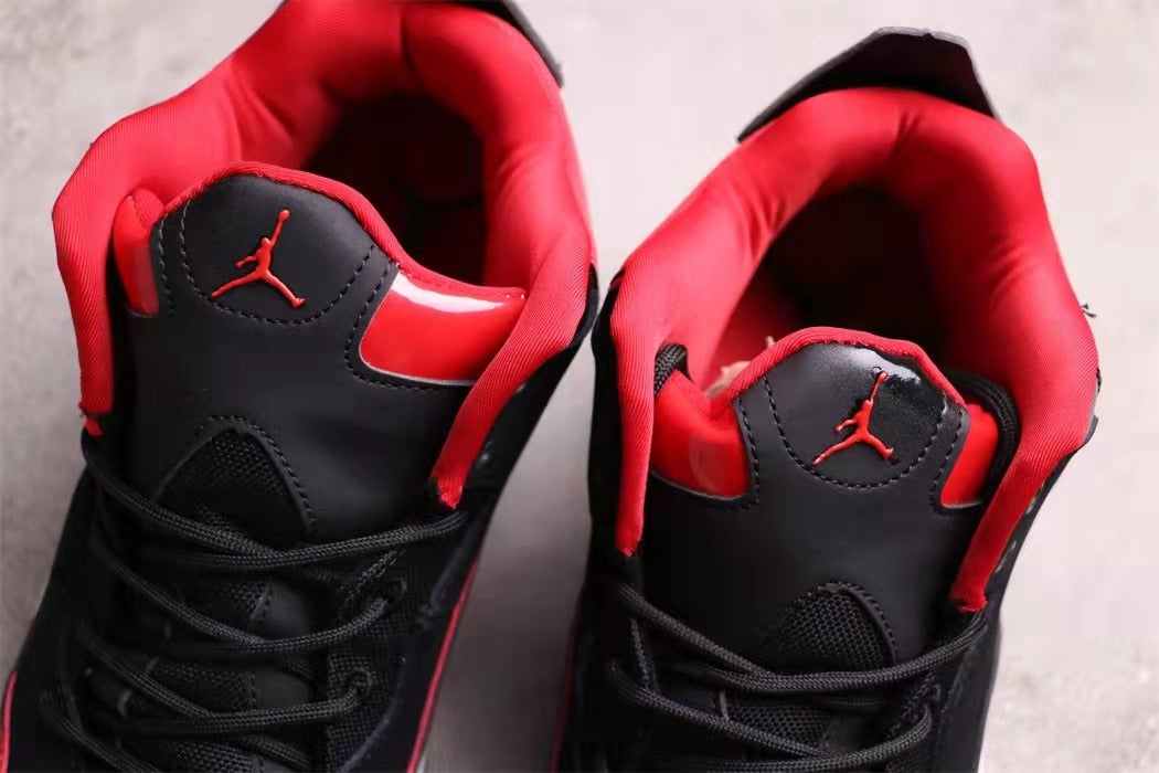 Top view showing the red padded collars, tongues, and black lace areas.