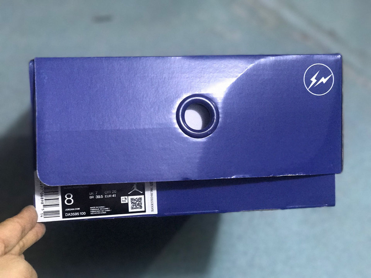 Purple shoe box with a visible label showing size 8, EU 41, and style code DA3595-100.