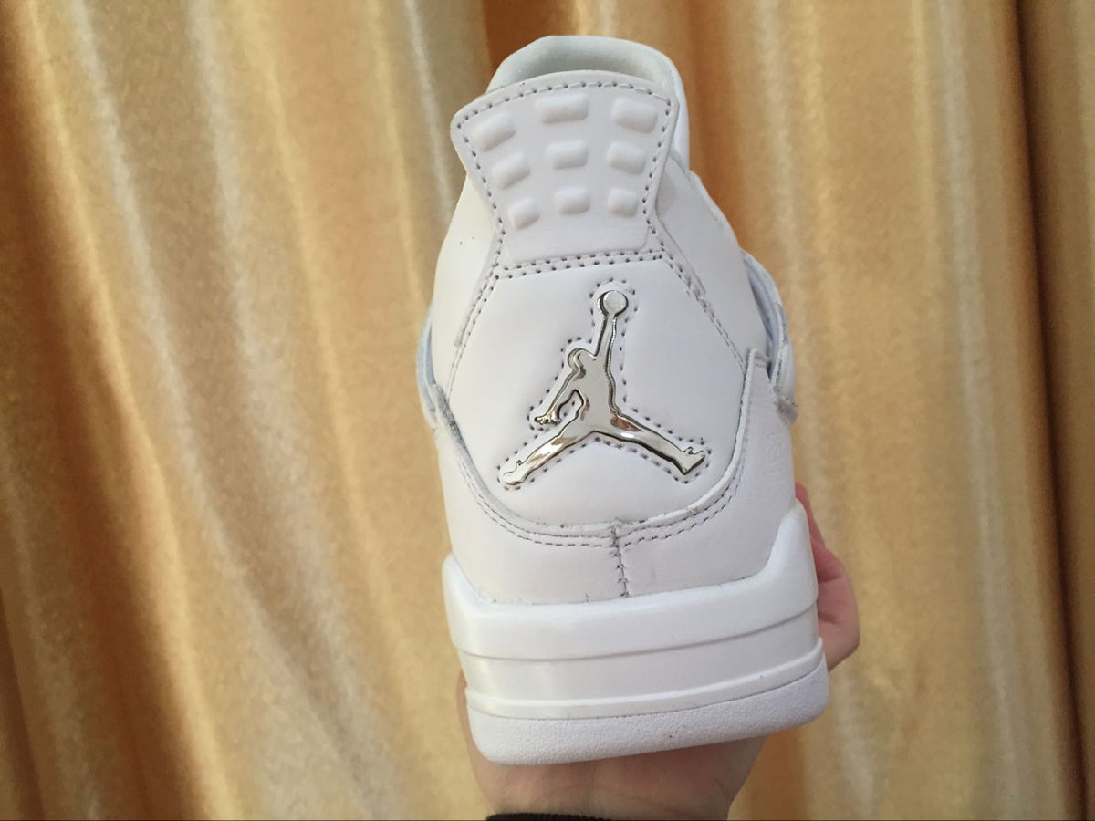 Rear view showing the raised Jordan logo detail on the white heel panel.