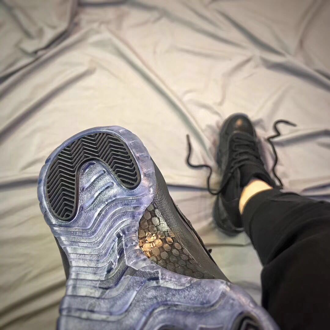 Close-up of the outsole showing translucent blue-gray sections and black traction areas.