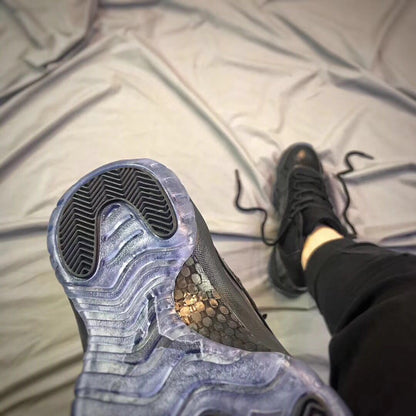 Close-up of the outsole showing translucent blue-gray sections and black traction areas.