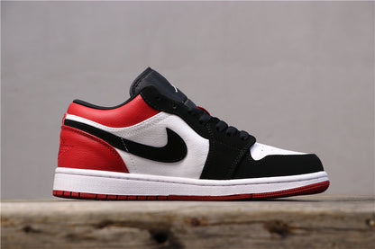 Outer side profile of the low-top sneaker in black, white, and red.