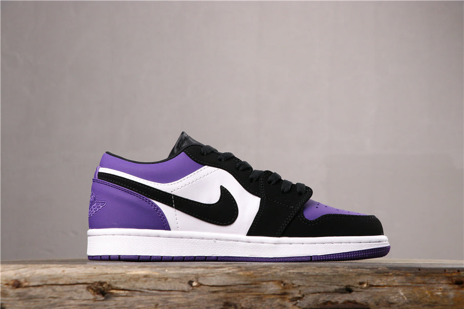 Lateral side view showing the black Swoosh, purple toe and heel sections, and white midsole.