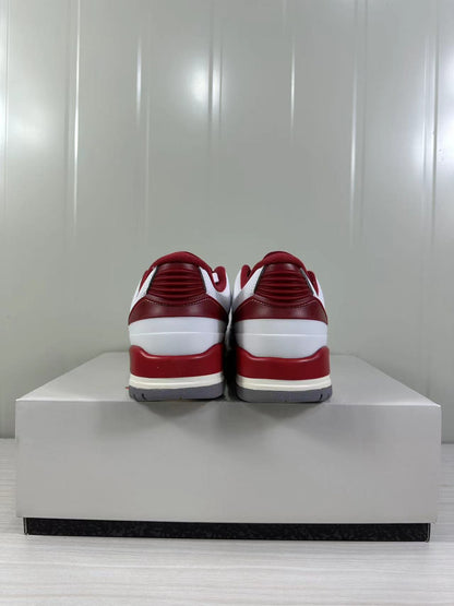 Rear view highlighting the red padded collars, heel panels, and layered midsole.