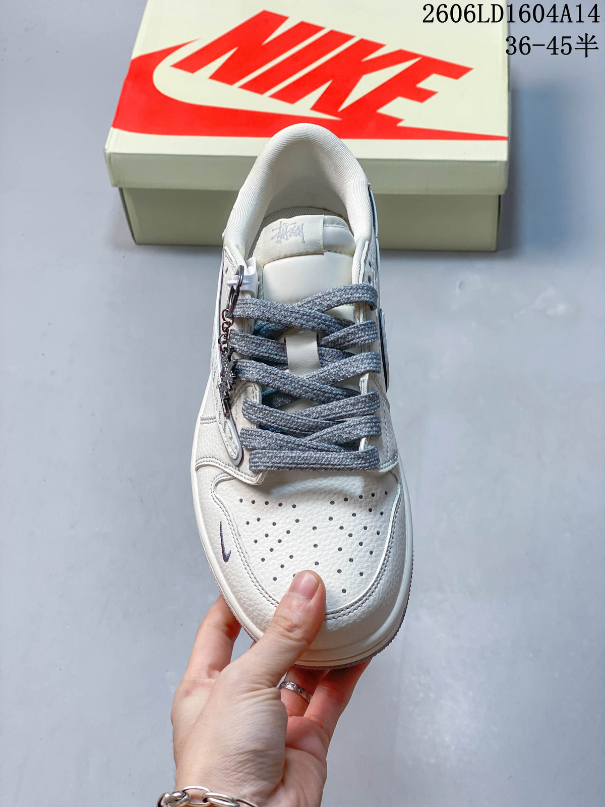 Travis Scott x Jordan 1 Low Sneakers in Ivory and Gray