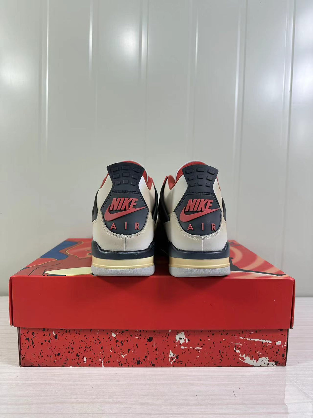 Rear view of the pair showing Jordan and Nike Air branding details on the heels.