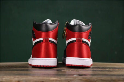Rear view showing red heel panels, black collars, white midsoles, and red outsoles.