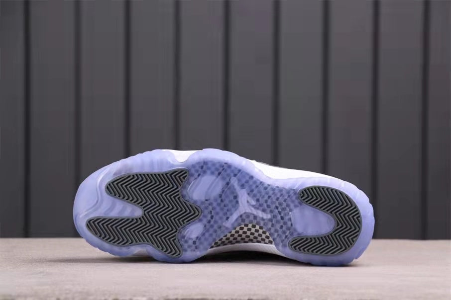 Bottom view showing the translucent blue outsole, black traction inserts, and central patterned section.