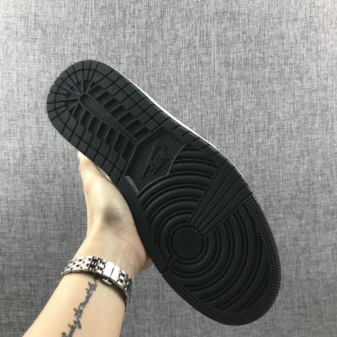 Underside view showing the black rubber outsole with circular traction patterns.