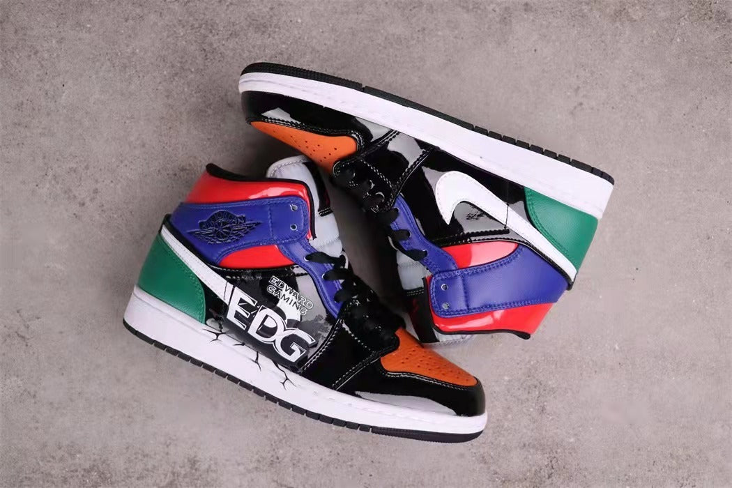 Top-down view of the pair showing the contrasting multicolor panel construction and white midsoles.