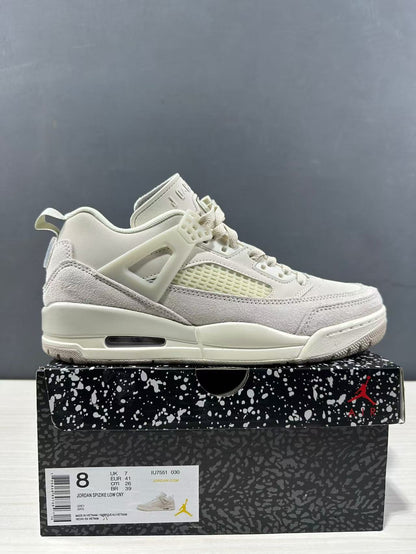 Side view of the sneaker beside its shoebox, with a visible box label showing style code IU7551-030 and sample size information.