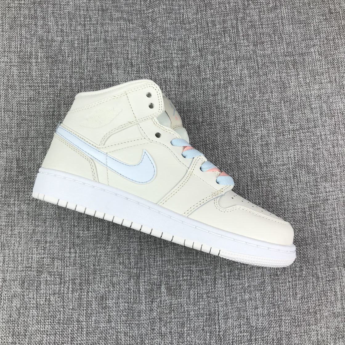 Angled single-shoe view showing an off-white upper, pastel blue Swoosh, padded collar and white outsole.