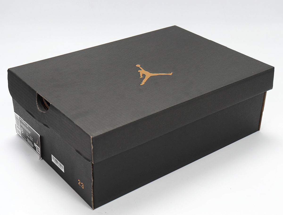 Black Jordan shoebox with a gold Jumpman logo.