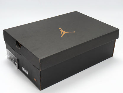 Black Jordan shoebox with a gold Jumpman logo.