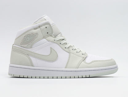 Side view of the sneaker displaying the Jordan Wings logo, Swoosh, lace-up construction, and color blocking.
