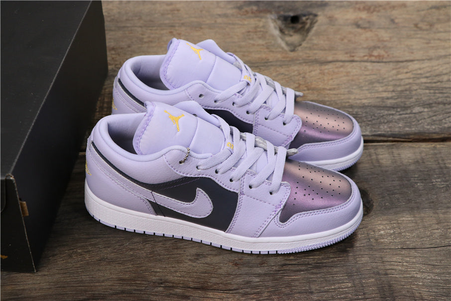 Angled view of the pair showing light purple uppers, dark side panels, contrasting Swoosh branding, and white midsoles.