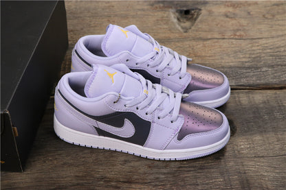 Angled view of the pair showing light purple uppers, dark side panels, contrasting Swoosh branding, and white midsoles.