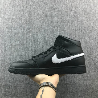 Opposite side profile showing the black upper, white Swoosh and black rubber outsole.