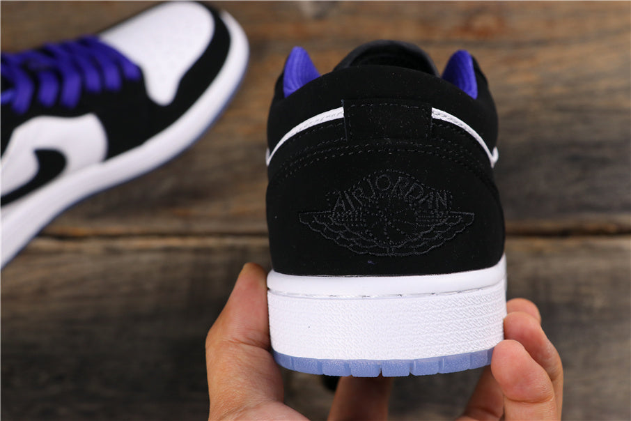 Rear view of the black heel with embossed Jordan Wings branding and a white midsole
